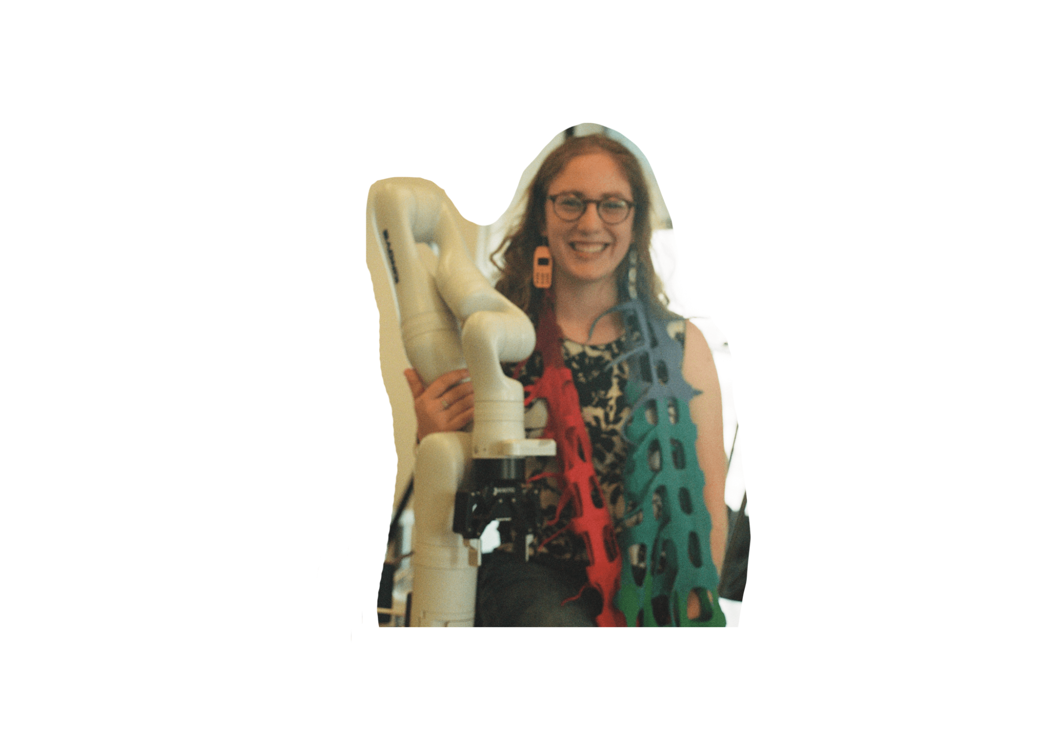 Natalie Friedman holding a robot dressed in colorful materials